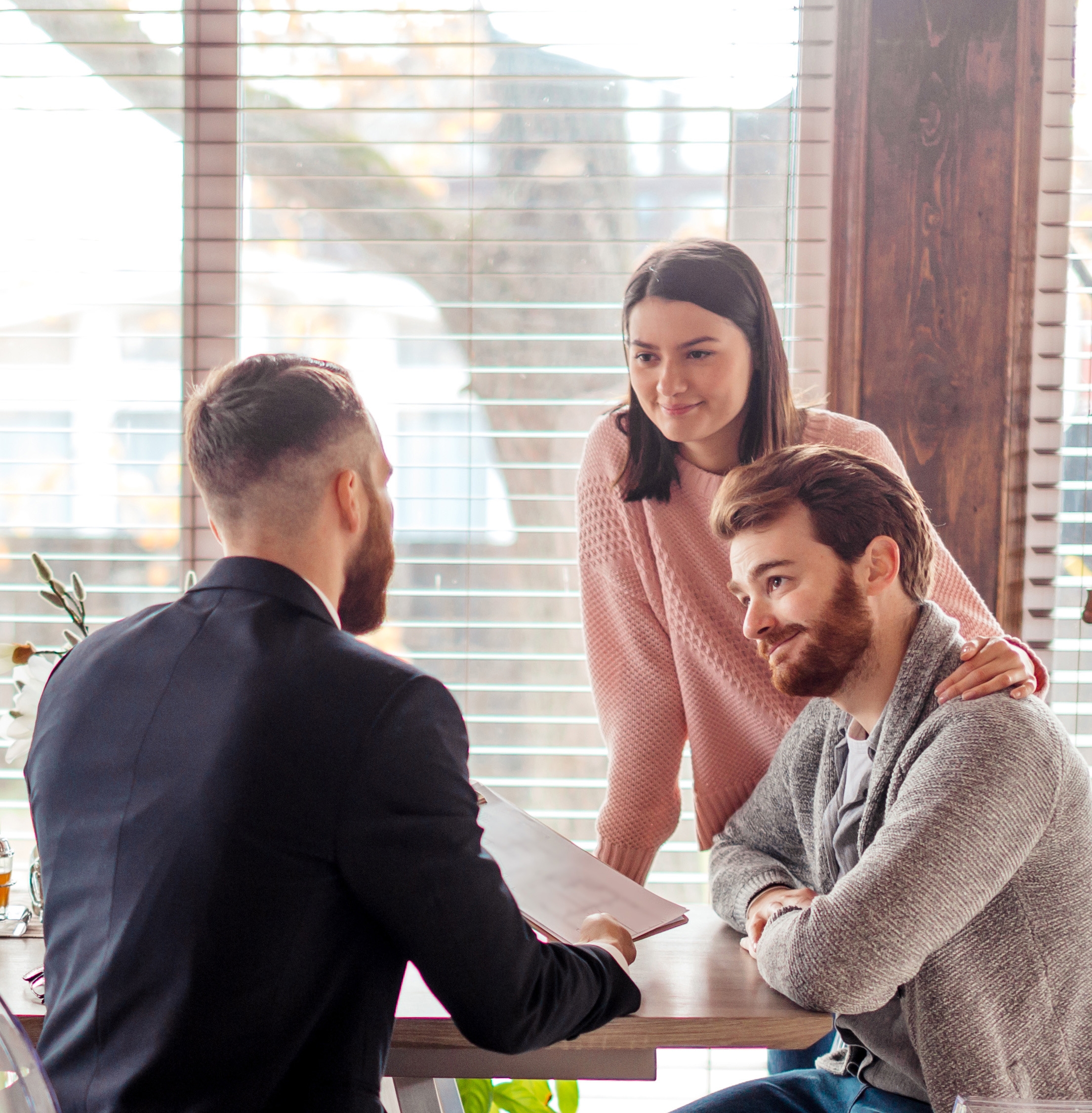 Couple talking to man